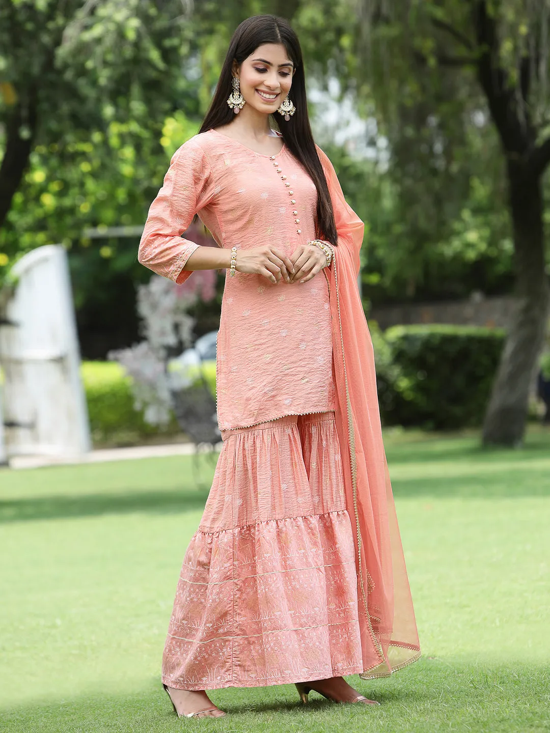 Juniper Peach Ethnic Motif Printed Viscose Muslin Kurta Sharara & Net Dupatta Set.