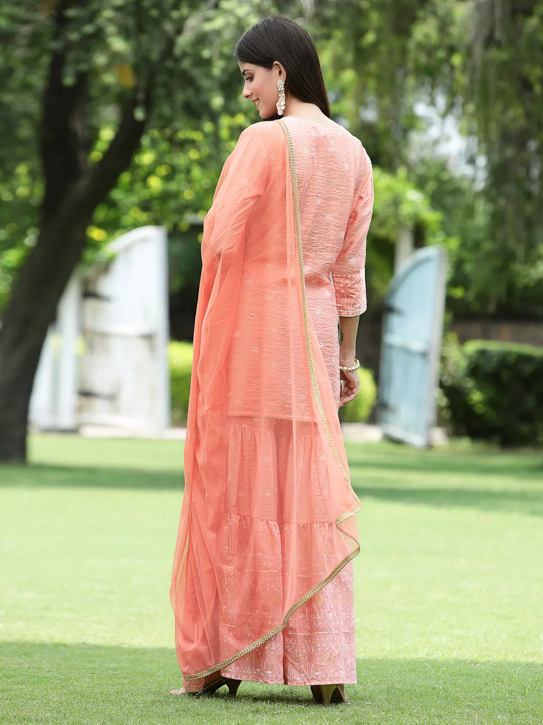 Juniper Peach Ethnic Motif Printed Viscose Muslin Kurta Sharara & Net Dupatta Set.